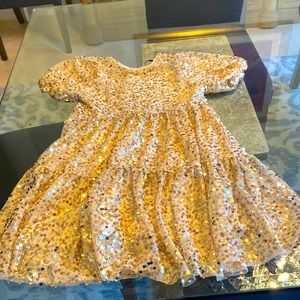 This is a sparkly golden Zara dress.
